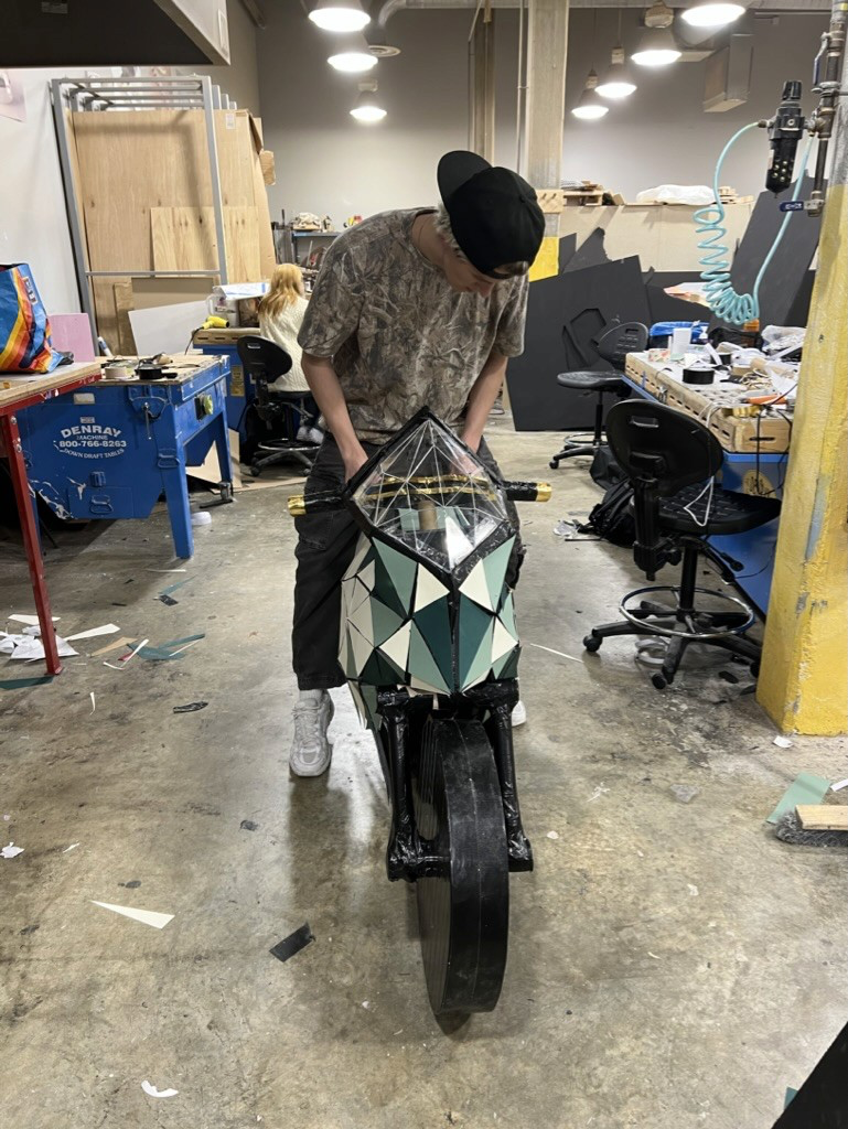 User testing the foam core motorcycle